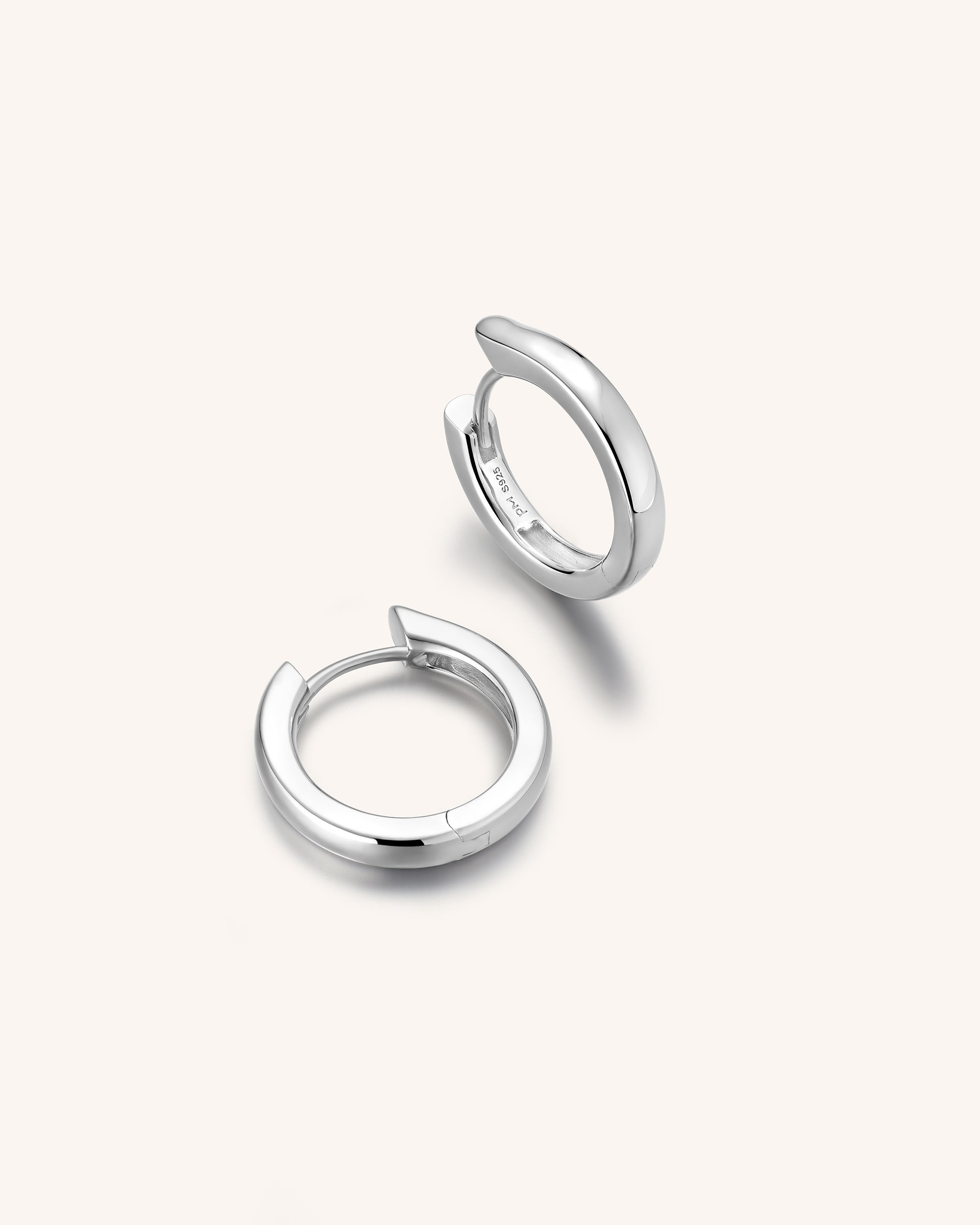 A pair of Silver Medium Forme Huggie Hoop for Men