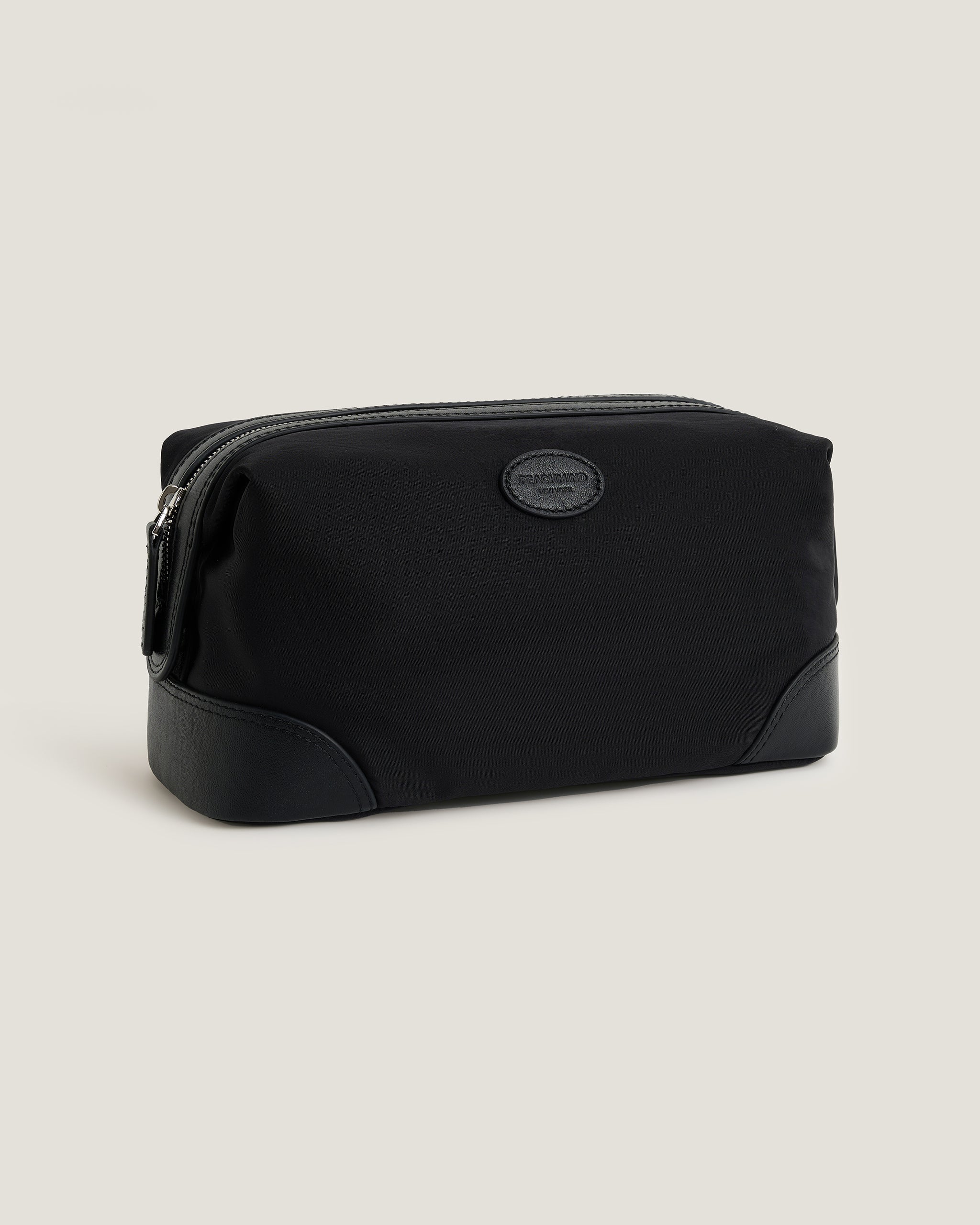 Black toiletry bag with PEACHMIND logo