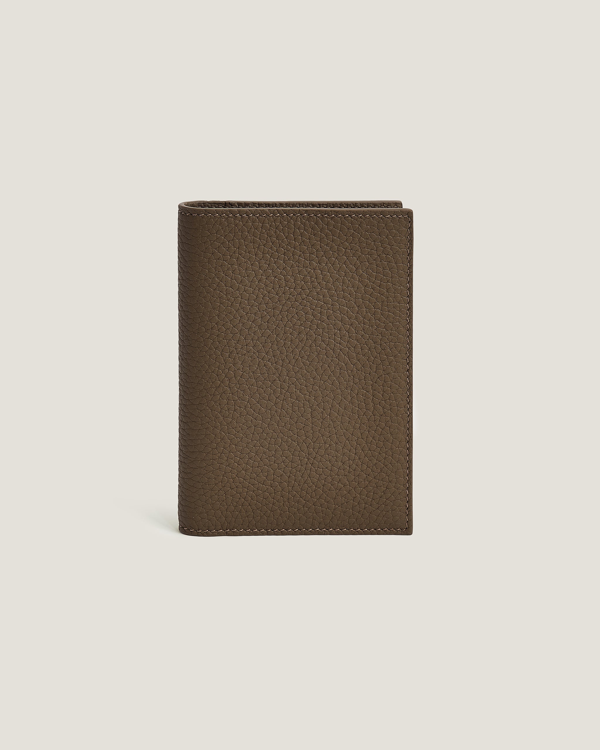 Brown Passport Cover on a beige background
